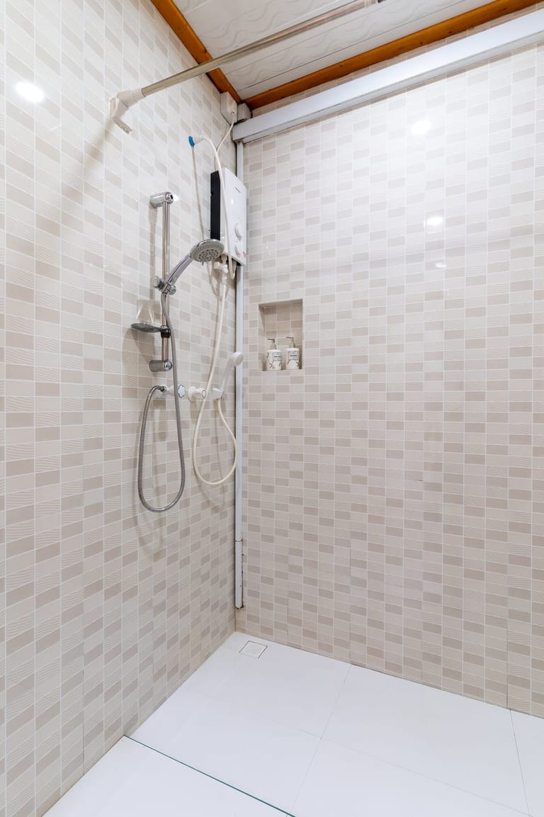 Bathroom 2: shower with beige tiles