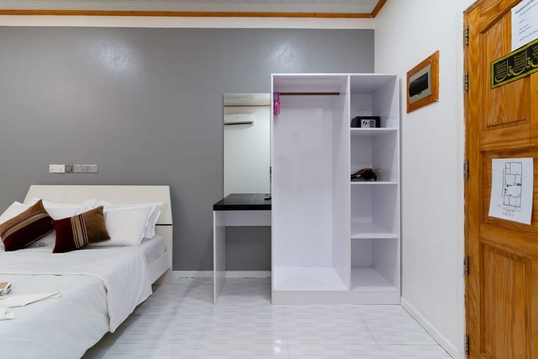 Bedroom wardrobe with an in-room safe at Maafolhey Han'dhaan.