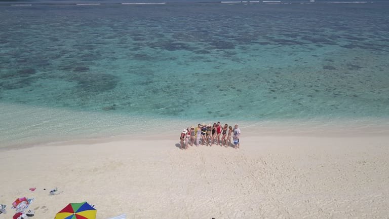 A group enjoying a quiet beach on Ukulhas island.