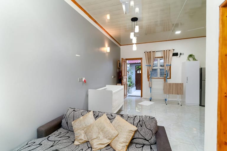 Living-room sofa with view out to the courtyard