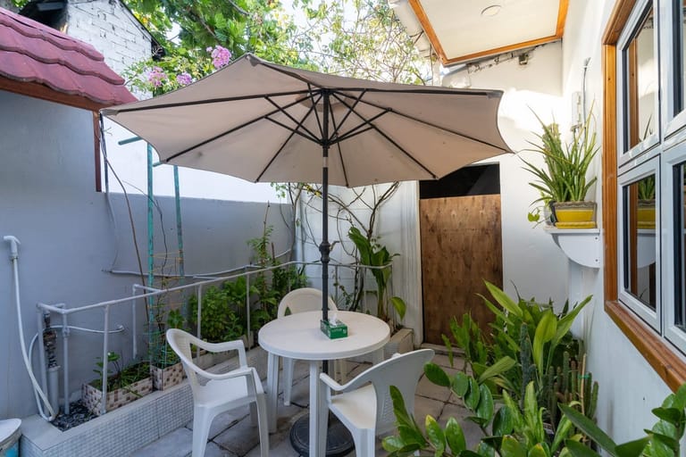 Outdoor patio courtyard with umbrella and table